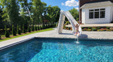 Global Pool Products Bad Axe X7 pool slide installed poolside, lifestyle view