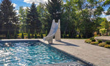 Bad Axe X7 pool slide at a residential swimming pool, lifestyle view 3