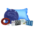 PoolTux Royal 28 foot round solid winter cover in blue on black on an above ground pool, bundled with a chemical closing kit and air pillow