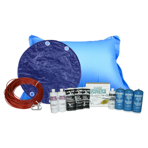 PoolTux Royal 28 foot round solid winter cover in blue on black on an above ground pool, bundled with a chemical closing kit and air pillow
