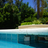 H2Flow Controls LevelSmart sensor installed at the waterline in a pool
