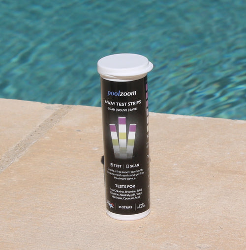 6 way pool and spa test strips held at the poolside
