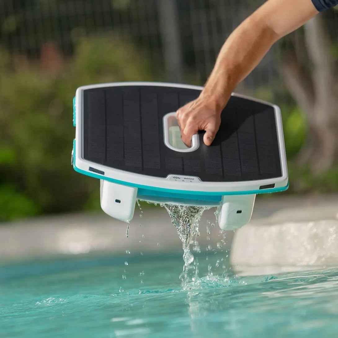 Dolphin Skimmi robotic skimmer floating on a pool