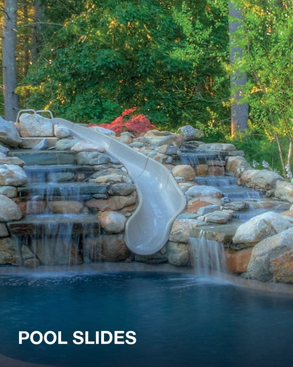 Pool slides: a curved slide set into a rock waterfall beside a backyard pool